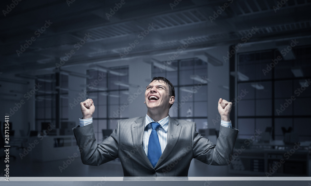 Happy excited businessman celebrating victory Happy excited businessman celebrating victory