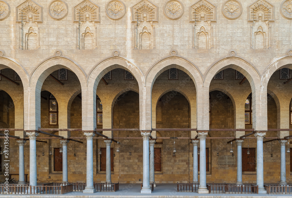 Arched corridor surrounding the courtyard of public ancient mosque of Sultan Al Moaayad, Old Cairo, Egypt