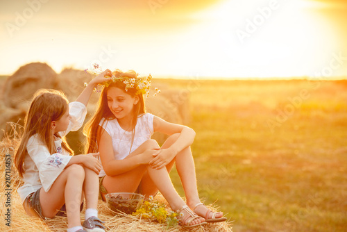 Two sisters spending time in field