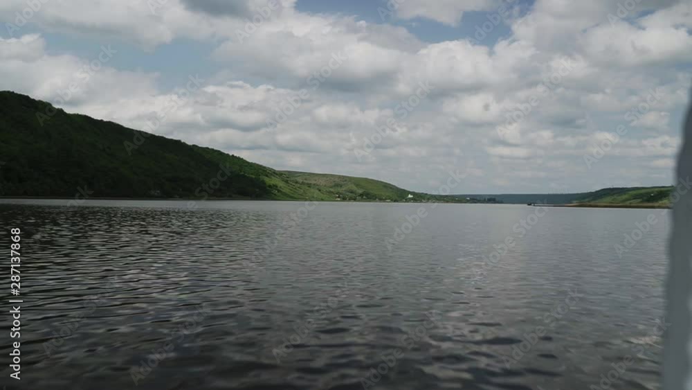 View from the motorboat on the river in motion View from the motorboat on the river in motion