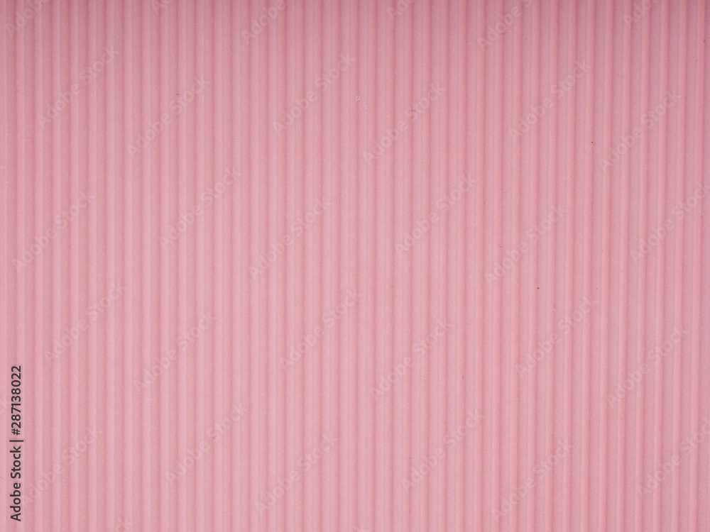 pink corrugated paper as background, copy space for text
