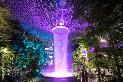 Jewel Changi Airport Rain Vortex, the largest indoor waterfall in the world and the centerpiece of Jewel Changi Airport by night