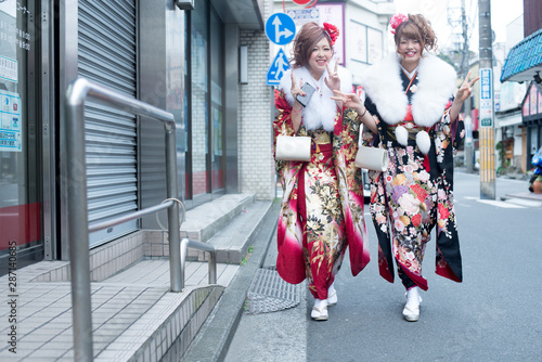 Japanese girls posing for the pictures of the Coming of Age Day. In Japan, people celebrate their 20s of a year as becoming adults wearing Japanese tradition dress.