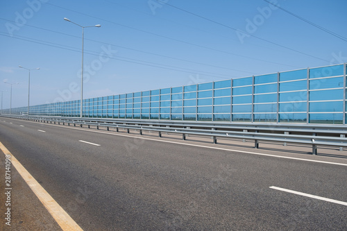 Noise barrier wall on a highway photo