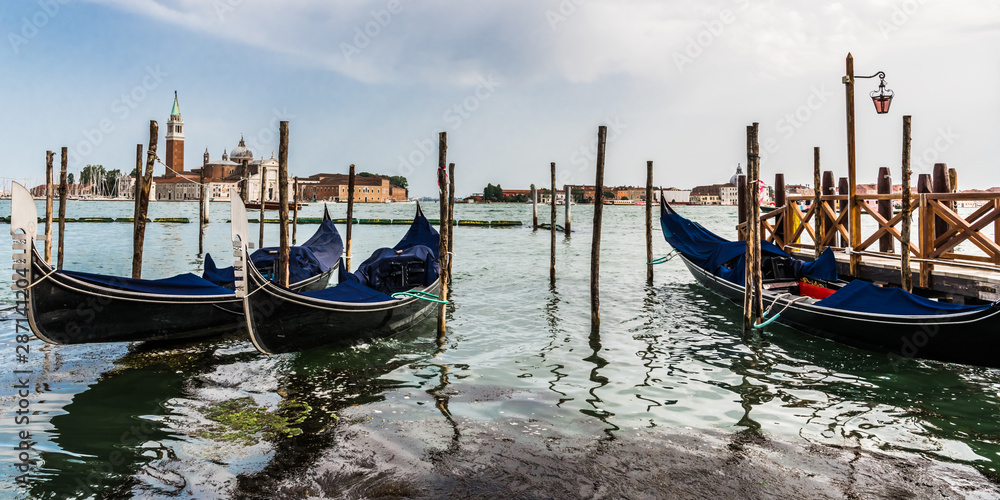 Morning on the pier with Venetian gondolas