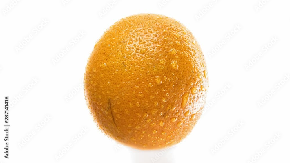 Smooth zoom. Drops of water fall from a juicy citrus peel. UHD 4K footage Smooth zoom. Drops of water fall from a juicy citrus peel. UHD 4K footage