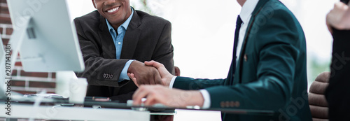 handshake international business partners on a Desk