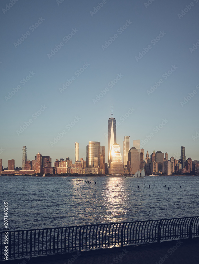 Manhattan skyline at sunset, color toning applied, New York City, USA.