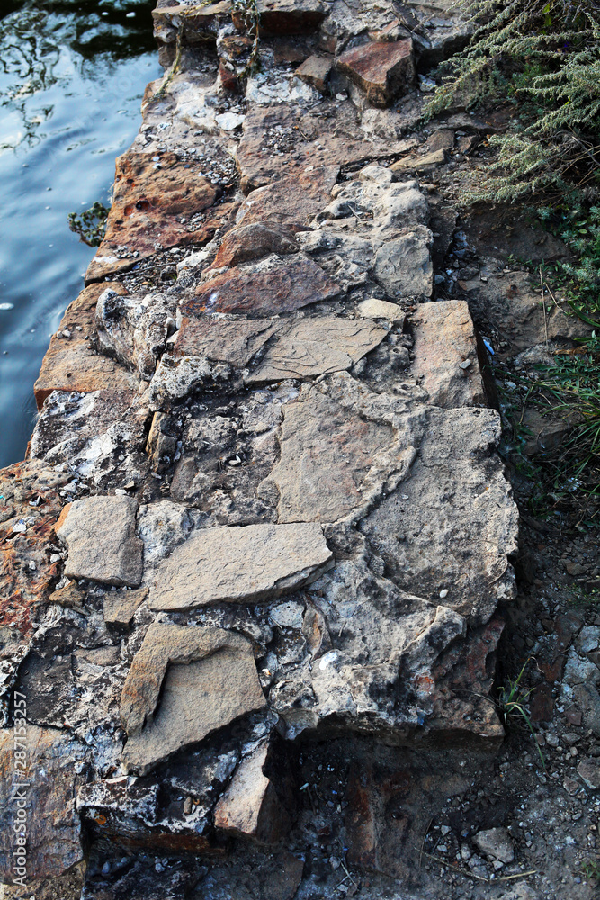 Stone destroyed artificial waterfall fence Stone destroyed artificial waterfall fence