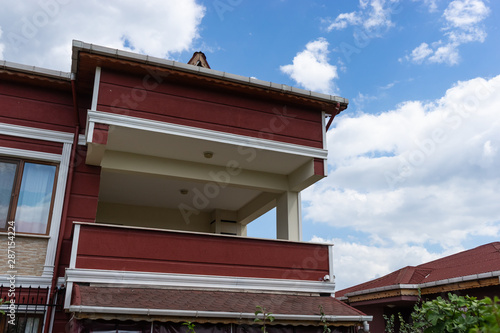 Village House at sunset with Blue Sky
