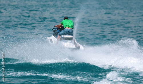 A man rides a water bike in the water