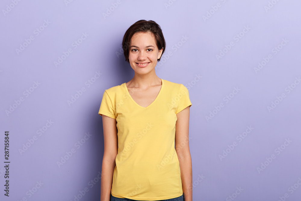 beautiful female student looking at the camera. close up photo. youth, people, isolated violet background beautiful female student looking at the camera. close up photo. youth, people, isolated violet background