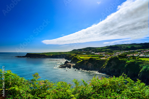 the cliff and the ocean, panorama of the coast in azores islands. portugal photo