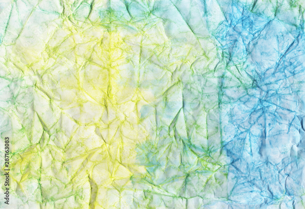 Blue and yellow crumpled paper. Sandy yellow and ocean blue wrinkled background. Color abstract wallpaper. Colorful craft page. Blue and yellow crumpled paper. Sandy yellow and ocean blue wrinkled background. Color abstract wallpaper. Colorful craft page.