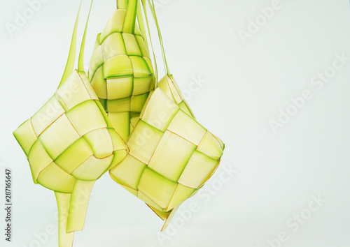 Ketupat or rice dumpling a famous main course during the festive season.Ketupat's, a rice casing made from young coconut leaves for cooking rice. photo