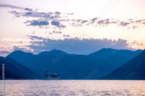 Cruise ship leaves the Bay of Kotor at sunset