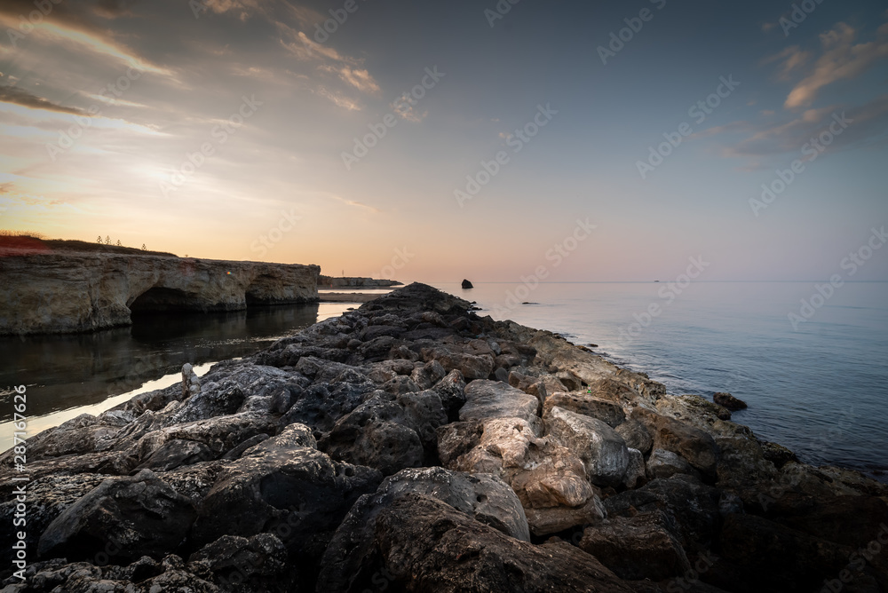 Shot of the Cirica Bay at sunrise. Cirica is a beautiful nature seaside place made of cliffs, rocks and sand in the southern Sicily, Italy