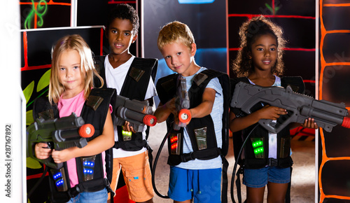 Group of ordinary tweenagers with laser guns
