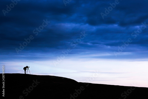 Male photographer on the mountain peak.