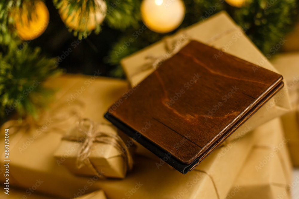 Fototapeta premium wooden book with christmas decoration on wooden background