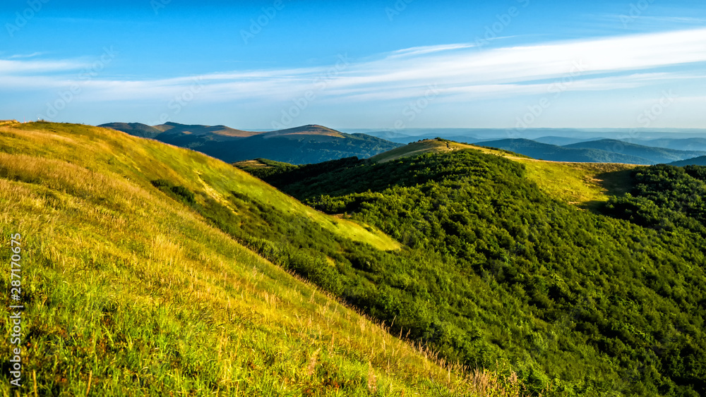Sunny summer day in the mountains. Photo from Wielka Rawka in the Bieszczady Mountains. Poland.