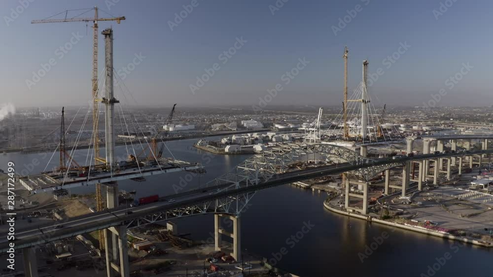 Aerial: Old Steel Bridge Over Water with Fast Moving Traffic in Port of Los Angeles on Sunny Day - San Pedro, California Aerial: Old Steel Bridge Over Water with Fast Moving Traffic in Port of Los Angeles on Sunny Day - San Pedro, California
