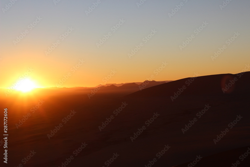 sunrise in namib desert from dune 45