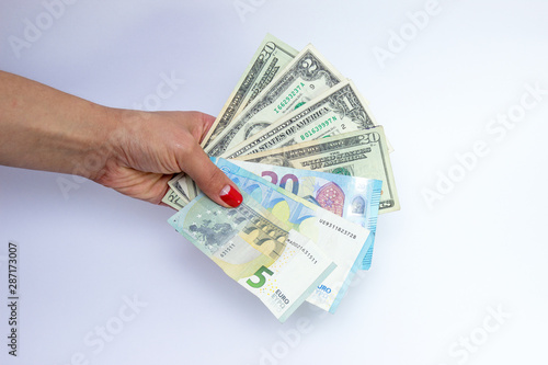 paper money in female hands, isoated on a white background. Business concept, savings, calculation.