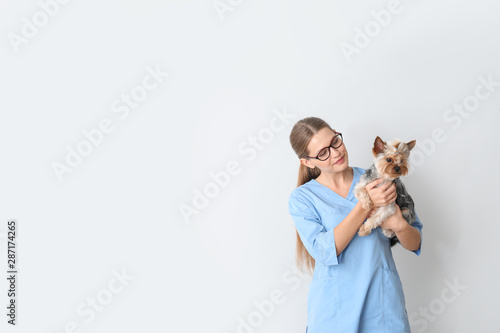 Veterinarian with cute dog ...