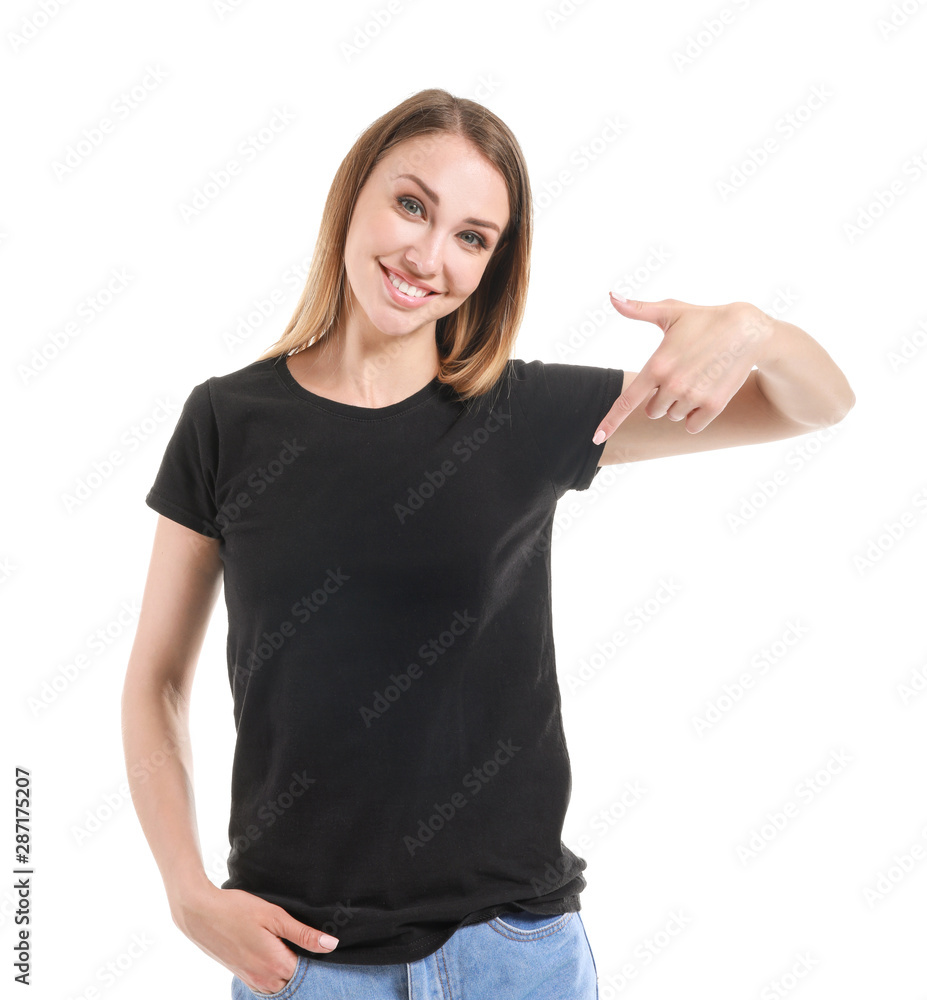 Woman pointing at her t-shirt against white background Woman pointing at her t-shirt against white background