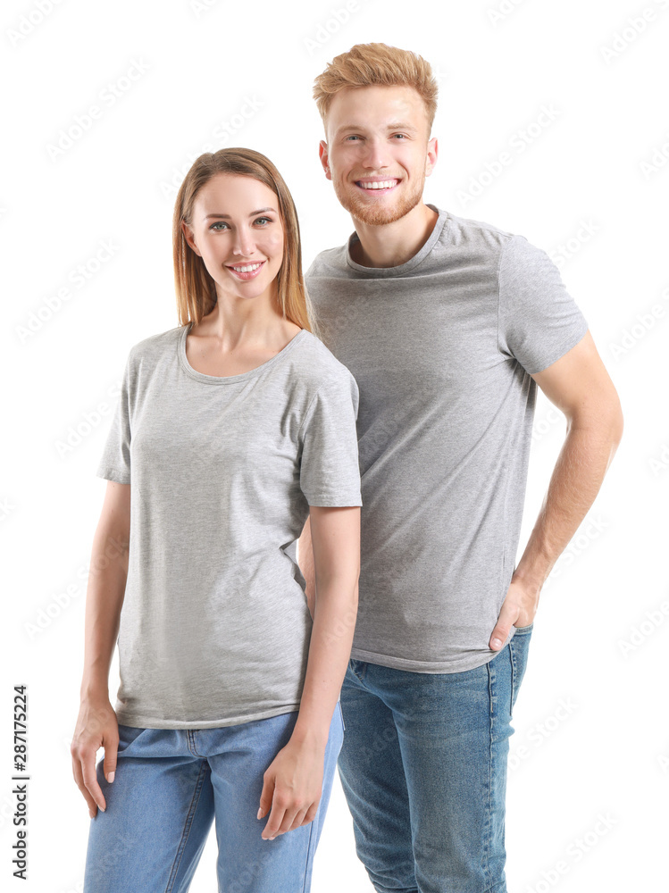 Couple in stylish t-shirts on white background Couple in stylish t-shirts on white background