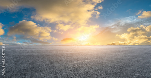 Empty race track road and beautiful sky clouds at sunset