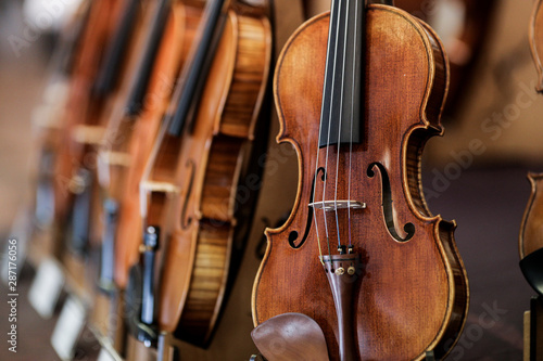 Details with parts of violins before a symphonic classical concert