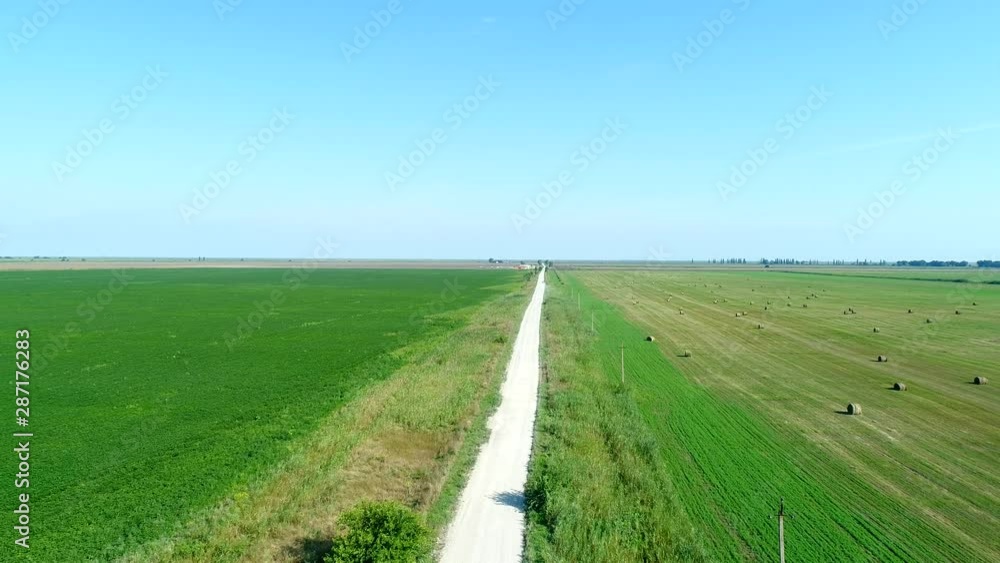 Aerial panorama, country road, haystacks in the field. Aerial panorama, country road, haystacks in the field.