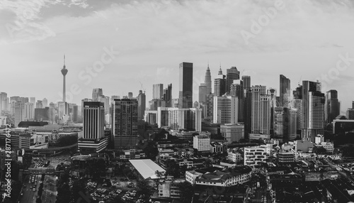 Aerial view of Kuala Lumpur city skyline during cloudy day  Malaysia - black and white photo