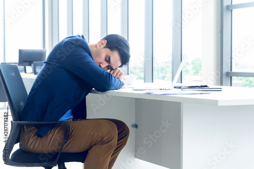 Принти на полотні A young businessman sitting in a modern office