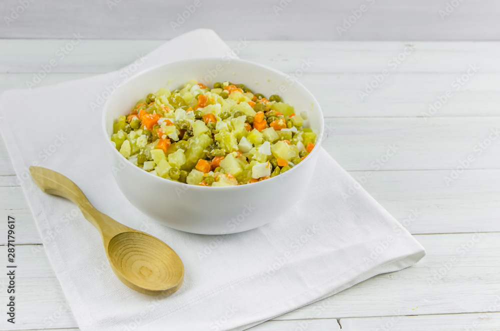 Russian salad Olivier with potato carrot green peas