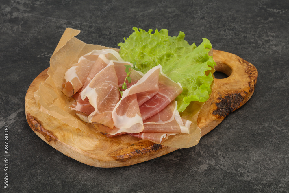Italian prosciutto pork meat over board