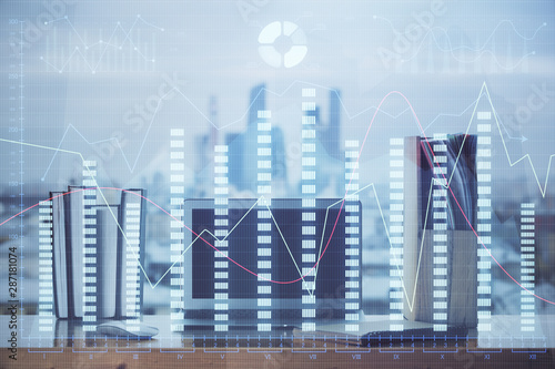 Financial chart drawing and table with computer on background. Double exposure. Concept of international markets.