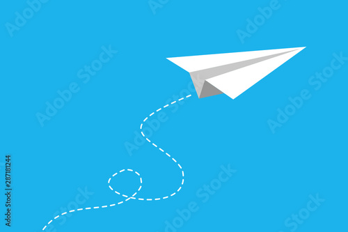 White paper plane flying on blue sky background