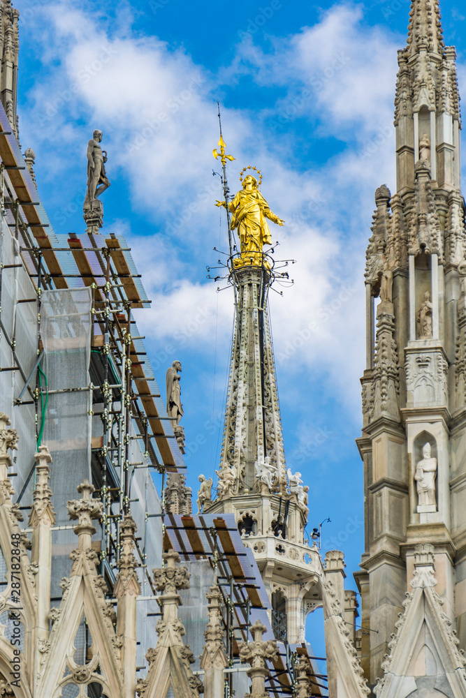 Statue of the Virgin Mary on top of Milan Cathedral (Duomo di Milano) in Italy
