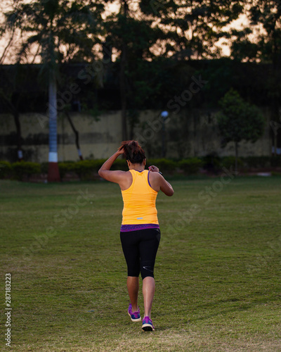 young woman running in the park