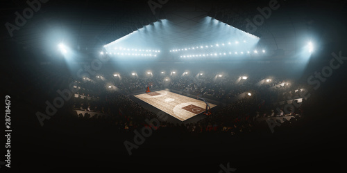 Professional floodlit basketball arena with spectators and fans cheering. High angle view photo