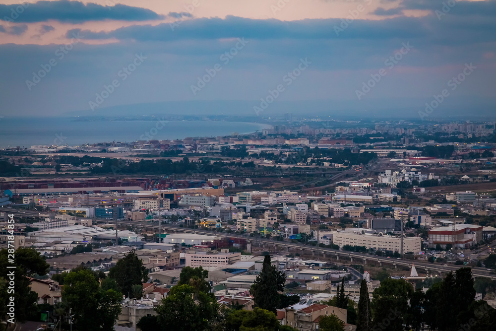 View of Haifa city downtrown and harbour port and sea at evening in twilight