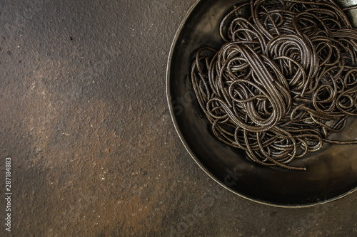 pasta black spaghetti with cuttlefish ink (main course) menu. top food background. copy space