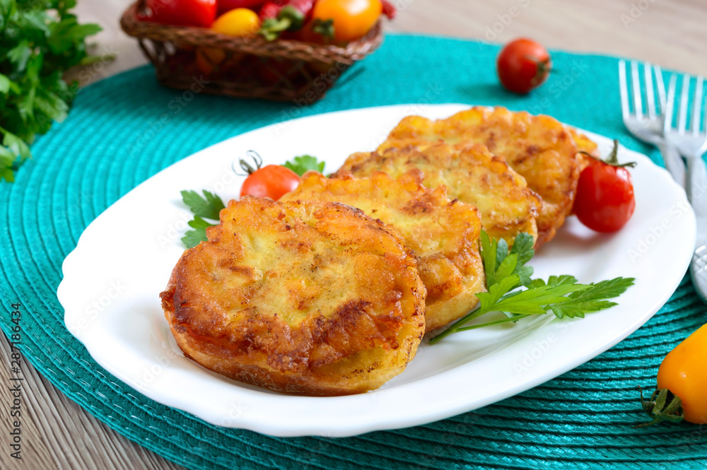 Tasty fried hot sandwiches with minced chicken on a white plate.