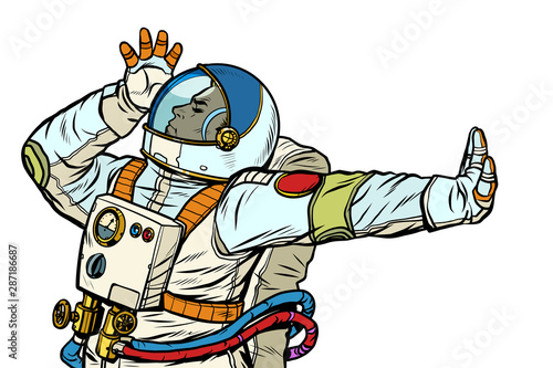 Astronaut in a spacesuit. Gesture of denial, shame, no