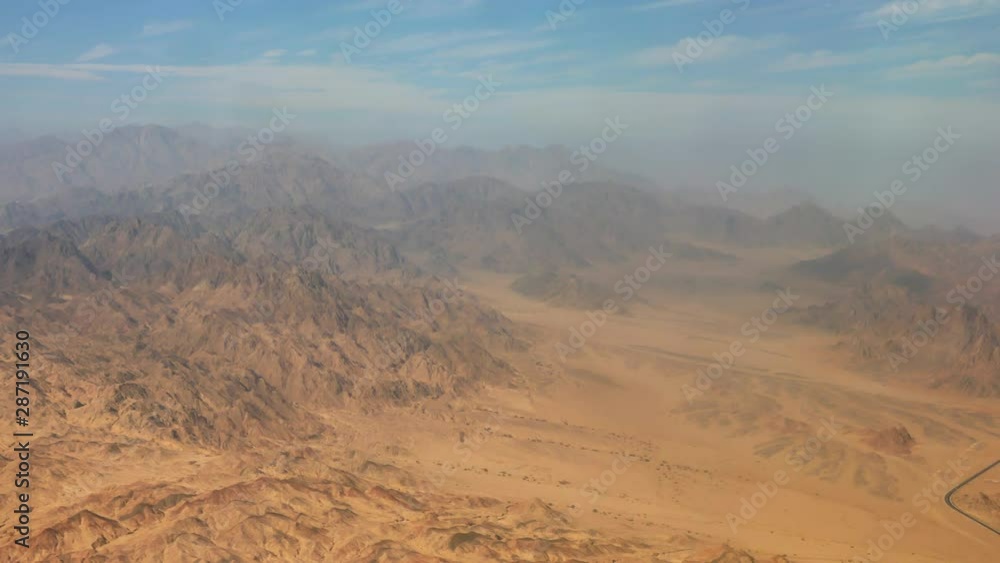 Sinai desert, mountains peaks, flat land and the road, Egypt Sinai desert, mountains peaks, flat land and the road, Egypt