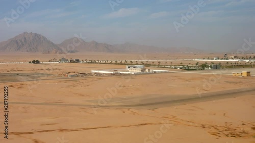 Plane lands in Sharm El Sheikh International Airport, Sinai, Egypt. POV from the passenger. photo