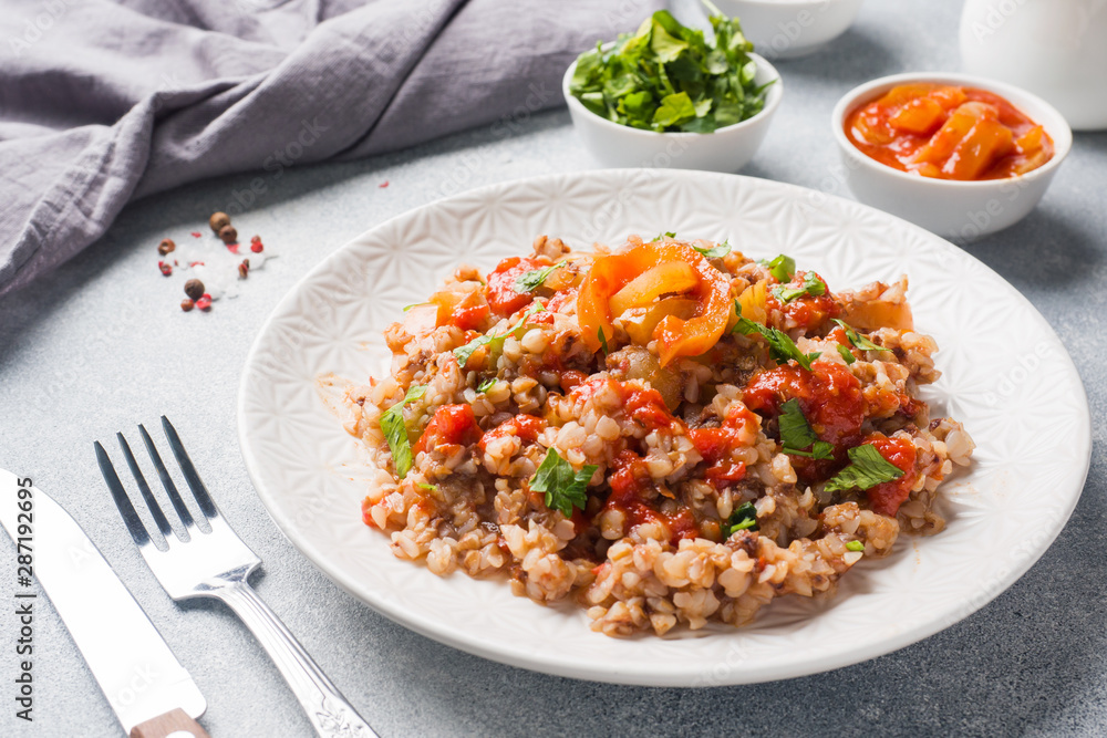 Buckwheat porridge with canned tomato and pepper.